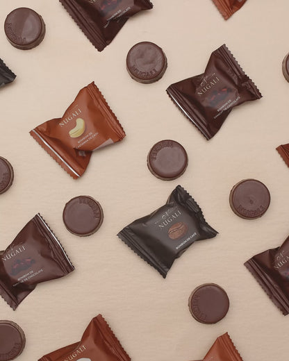 Bombons Nugali, produzidos com chocolate ao leite premium e recheios de ingredientes selecionados de castanha de caju, avelã, ganache e café, sabor premium e sofisticação.